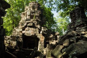 Ancient moss-covered stone towers of Banteay Chhmar Temple ruins in Banteay Meanchey Cambodia