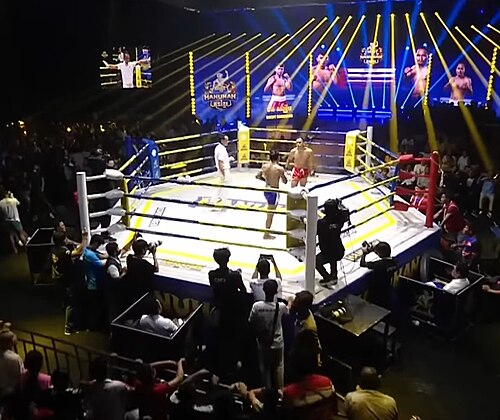 A live Kun Khmer martial arts match in Phnom Penh; get reliable transportation to the stadium with Phnom Penh Taxi Drive.