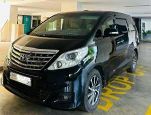 Black Toyota Alphard luxury minivan for VIP private transfers in Phnom Penh.