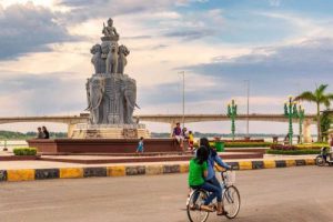 The Kizuna Bridge and riverside monument in Kampong Cham, Cambodia; travel from Phnom Penh with Phnom Penh Taxi Drive.