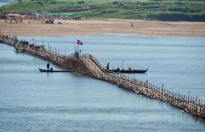 The famous seasonal bamboo bridge in Kampong Cham, Cambodia, accessible via Phnom Penh Taxi Drive private transfers.