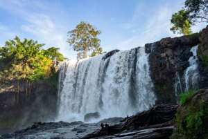 Wide view of the powerful Bousra Waterfall cascading over rocks in Mondulkiri Province Cambodia
