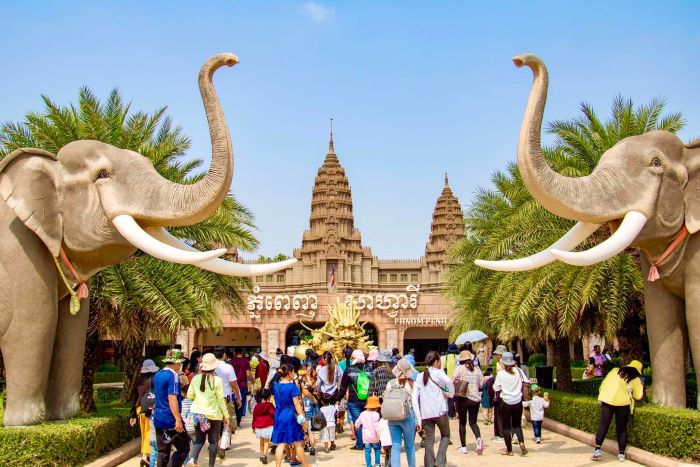 The grand entrance of Phnom Penh Safari World featuring giant elephant statues; book your family day trip with Phnom Penh Taxi Drive.