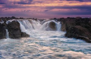 The powerful Sopheakmit Waterfall on the Mekong River in Stung Treng; travel there by private car with Phnom Penh Taxi Drive.