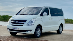 White Hyundai Starex van for private group transfers in Phnom Penh, Cambodia.
