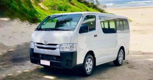White Toyota Hiace 15-seater van for private group transfers in Phnom Penh, Cambodia.