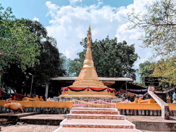 The golden Yey Yat Shrine at Phnom Yat, Pailin, a top cultural landmark visited on private tours by Phnom Penh Taxi Driver.