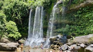 Scenic view of the upper tiers of Phnom Kulen Waterfall; travel comfortably from Phnom Penh with Phnom Penh Taxi Drive.