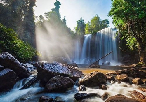 The majestic Phnom Kulen Waterfall in Siem Reap; book a private day tour from Phnom Penh with Phnom Penh Taxi Drive.