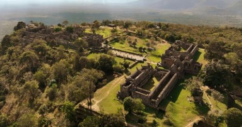 Aerial landscape view of the ancient Preah Vihear Temple ruins on the cliff edge, Cambodia, with Phnom Penh Taxi Driver tour services.