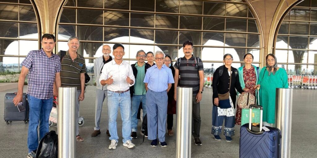 Professional Phnom Penh taxi drivers with a group of international tourists at the airport.