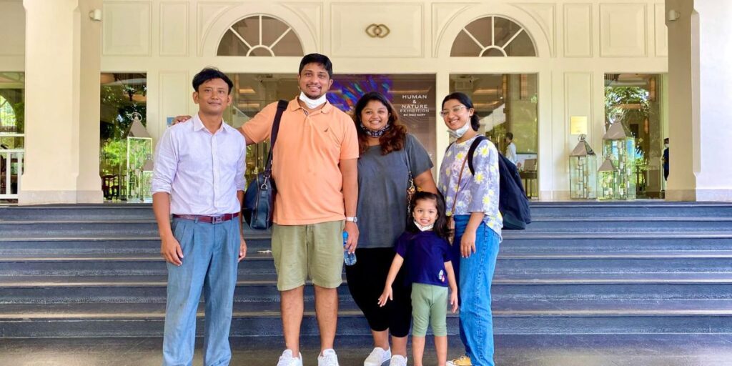 Professional English-speaking driver in Phnom Penh with a happy family at the airport.